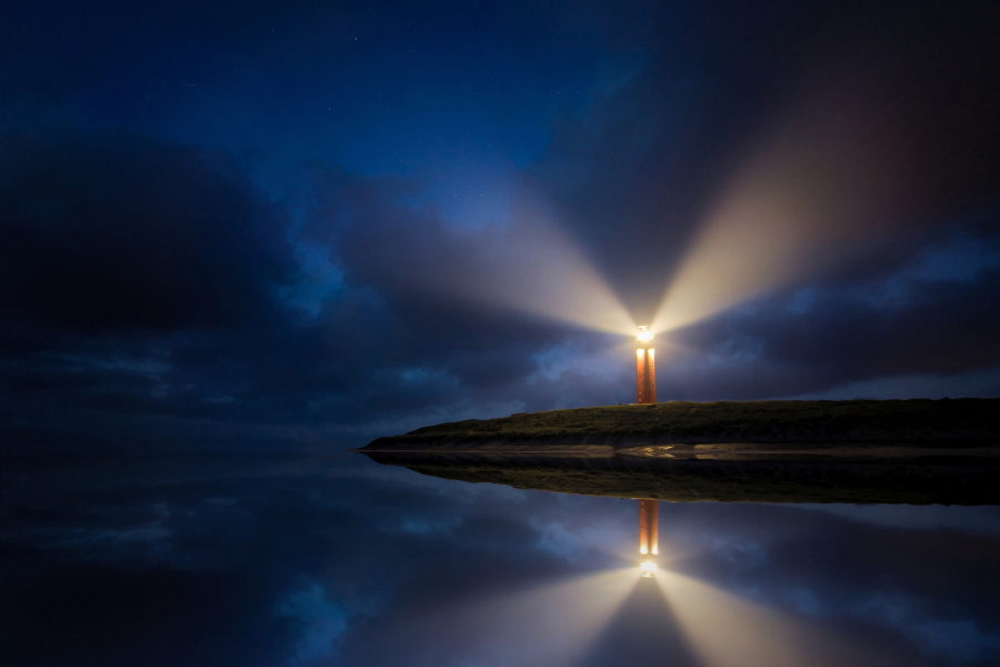 Image of a lighthouse at night
