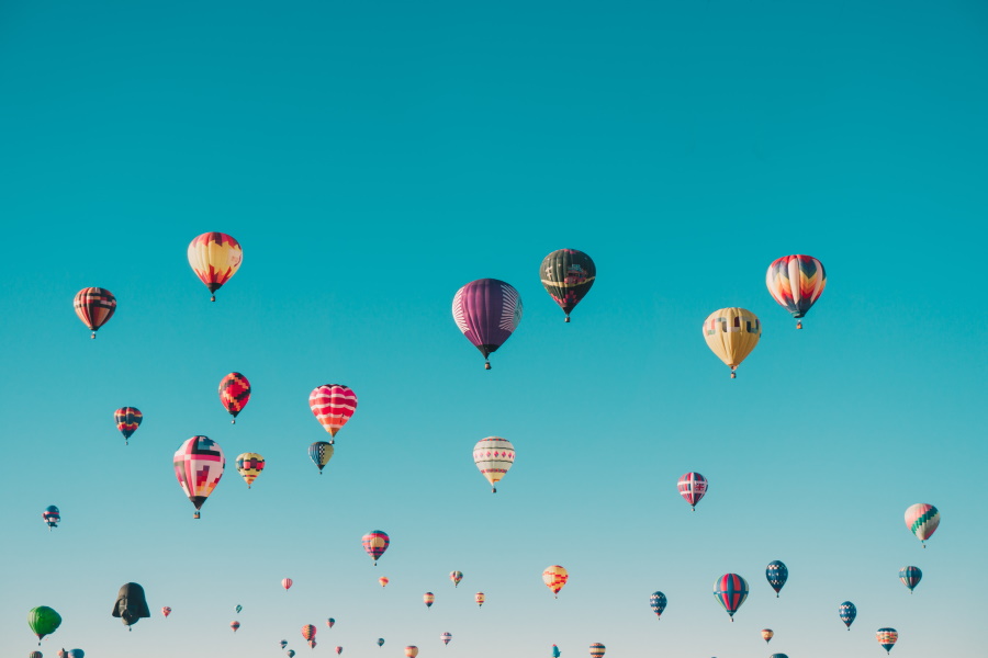 Photo of air balloons against a blue sky