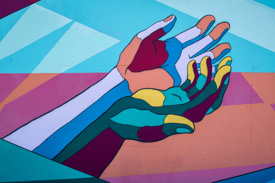 Drawing of two hands held up next to each other in lots of colors