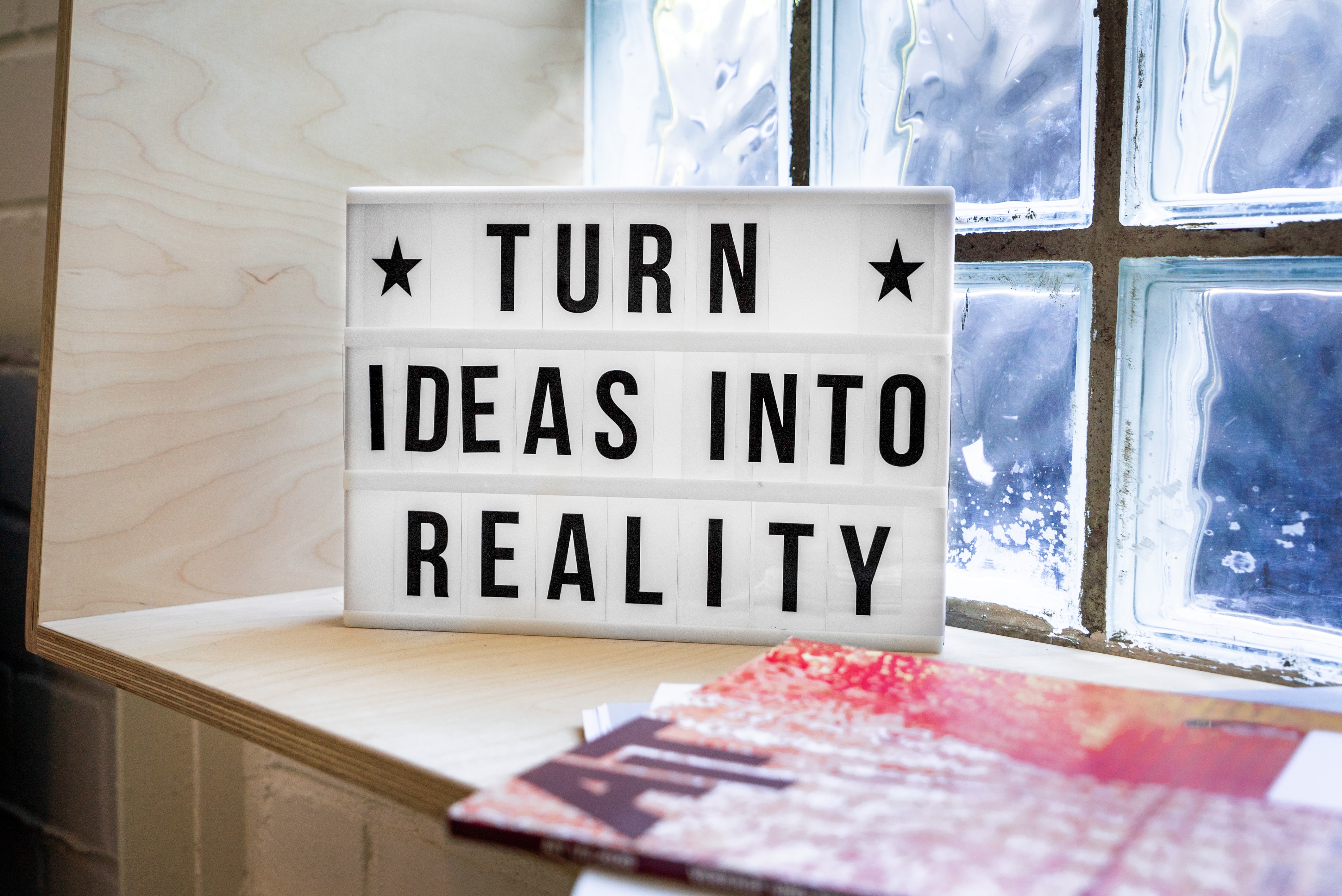 Photo of a sign that says: Turn ideas into reality